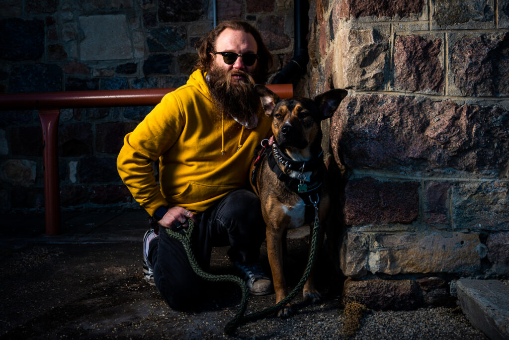 Photograph of Jason and his dog.